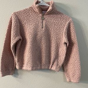 It is a bit of a darker pink off camera.It is very soft!